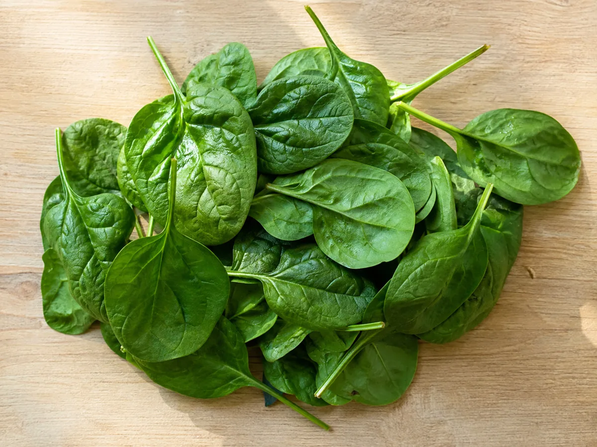 Fresh spinach leaves for a blood pressure-friendly food guide.